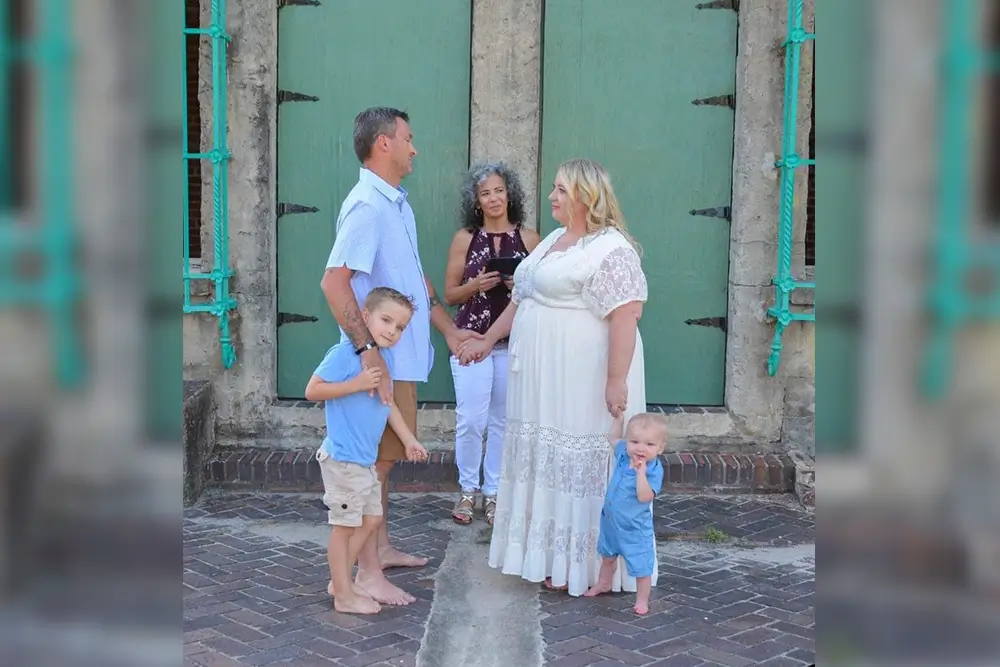 Family wedding ceremony with two kids.