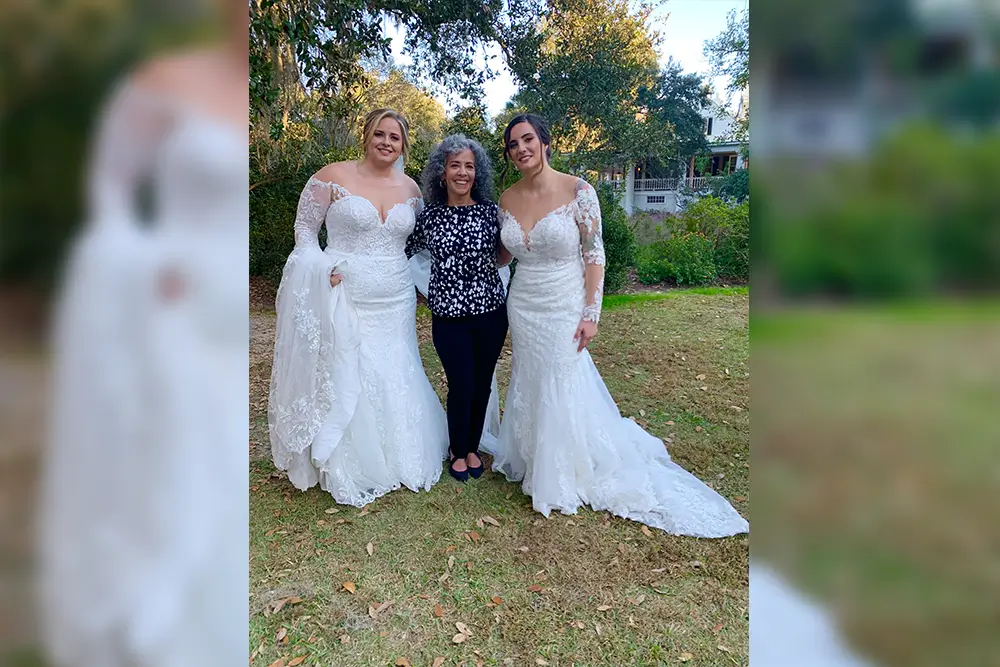 Three women in wedding dresses.